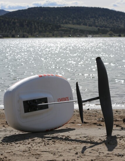 A hydrofoil attaches to the bottom of a board and isn't visible until the rider is lifted into the air. 