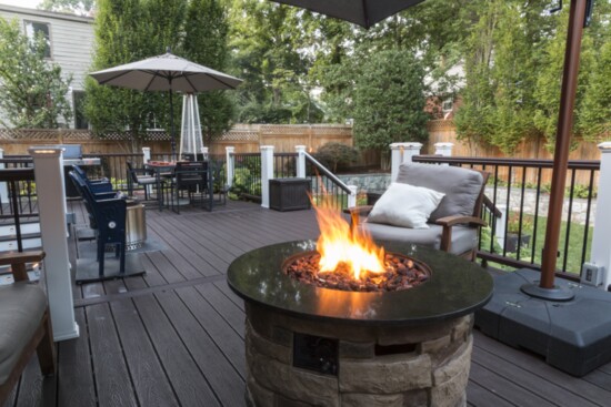 A cheerful fire feature creates a natural gathering place for friends and family.