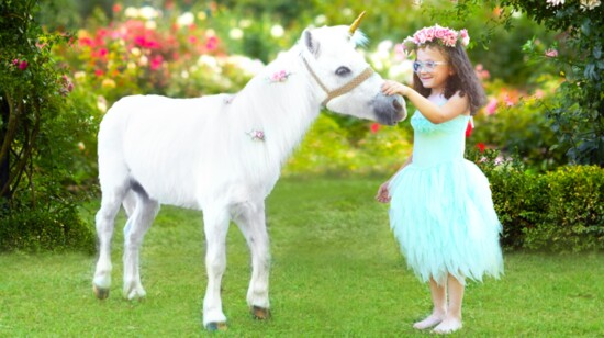 A "unicorn" greets Janie in Bear Creek Park, Houston.