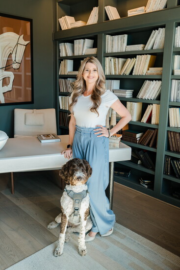 Nicole, the Founder & Director of Serenity Wellness and Counseling Centered pictured with Therapy Dog, Oakley
