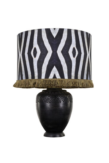 Mindthegap Lighting, Table Damara Drum Lamp Shade, Makonde Base, Fringed Portrait Credit: MINDTHEGAP