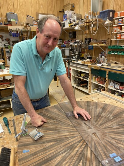 Warren Snow works on a new compass rose table