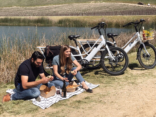 Enjoying electric bikes and a picnic at Cass Winery. Courtesy Cass Winery