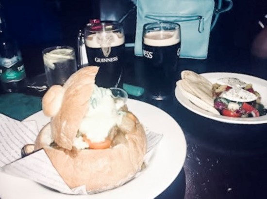 A hearty bread bowl of Guinness stew and, of course, a Guinness to go with it after a big day of sight-seeing in Dublin, Ireland