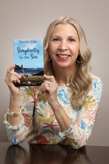 Jennifer Vido with her newest book. Photo Credit: Robin Sommers