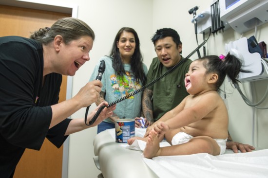 Dr. Amy Harper examines Remy just weeks after life-changing infusion.