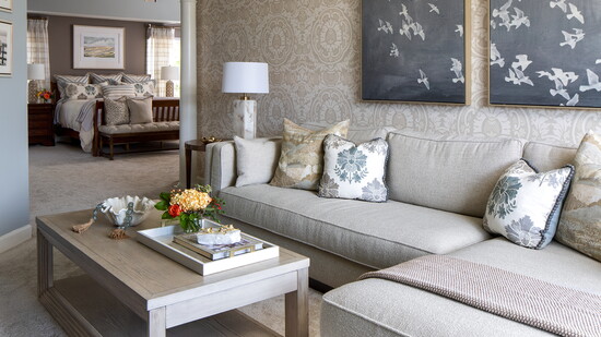 Living room with bedroom in the background. Photo Credit: East + Lane