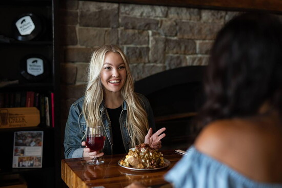 William Oliver’s Windsor, a welcoming community space on Main Street where friends can slow down, share a meal, and connect over great food.